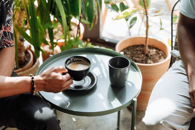 two-people-having-coffee-sunny