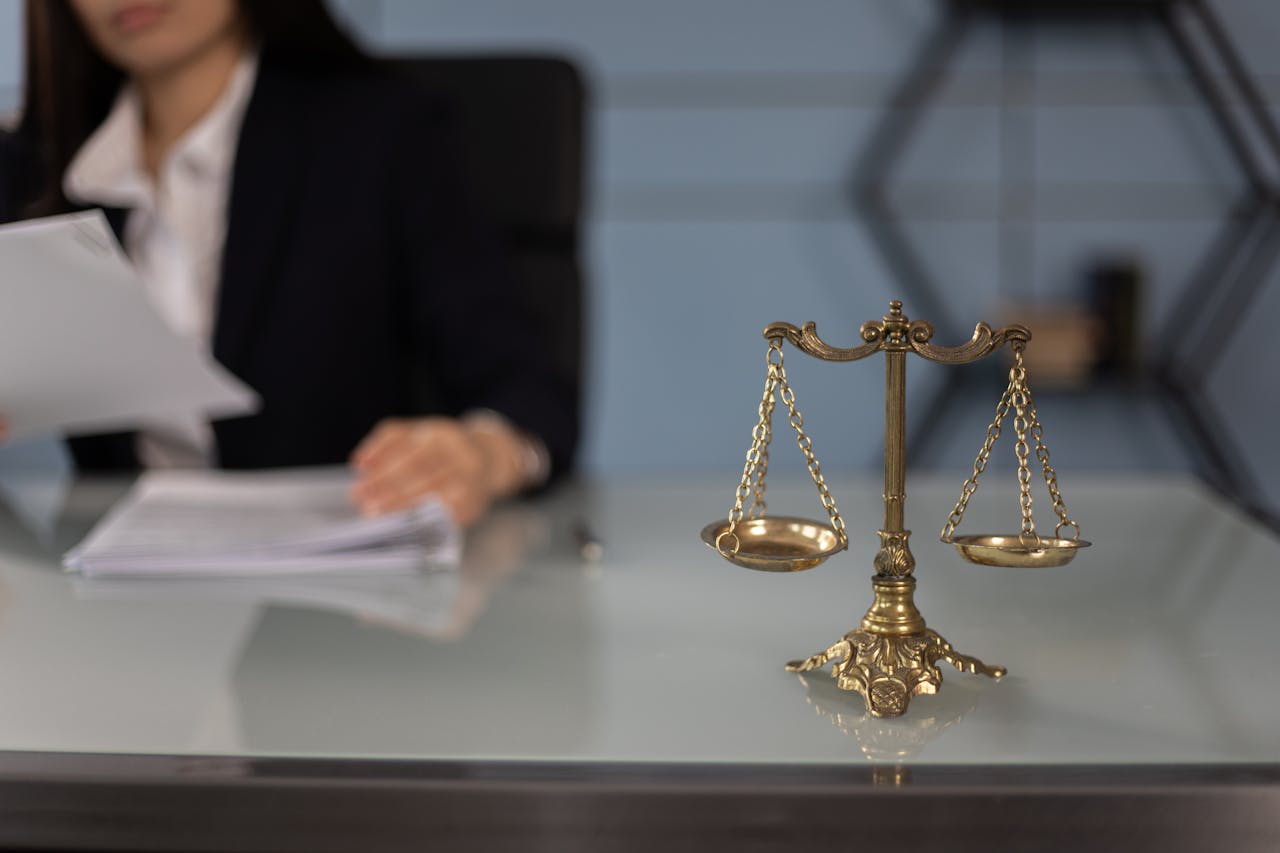 legal scales and person writing